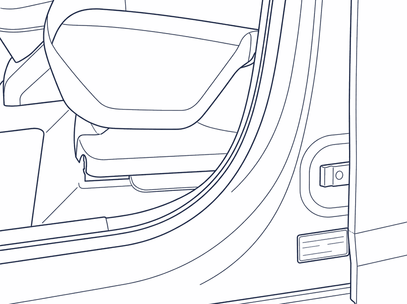 The type plate low on the door pillar behind the front passenger door, seen with the door open
